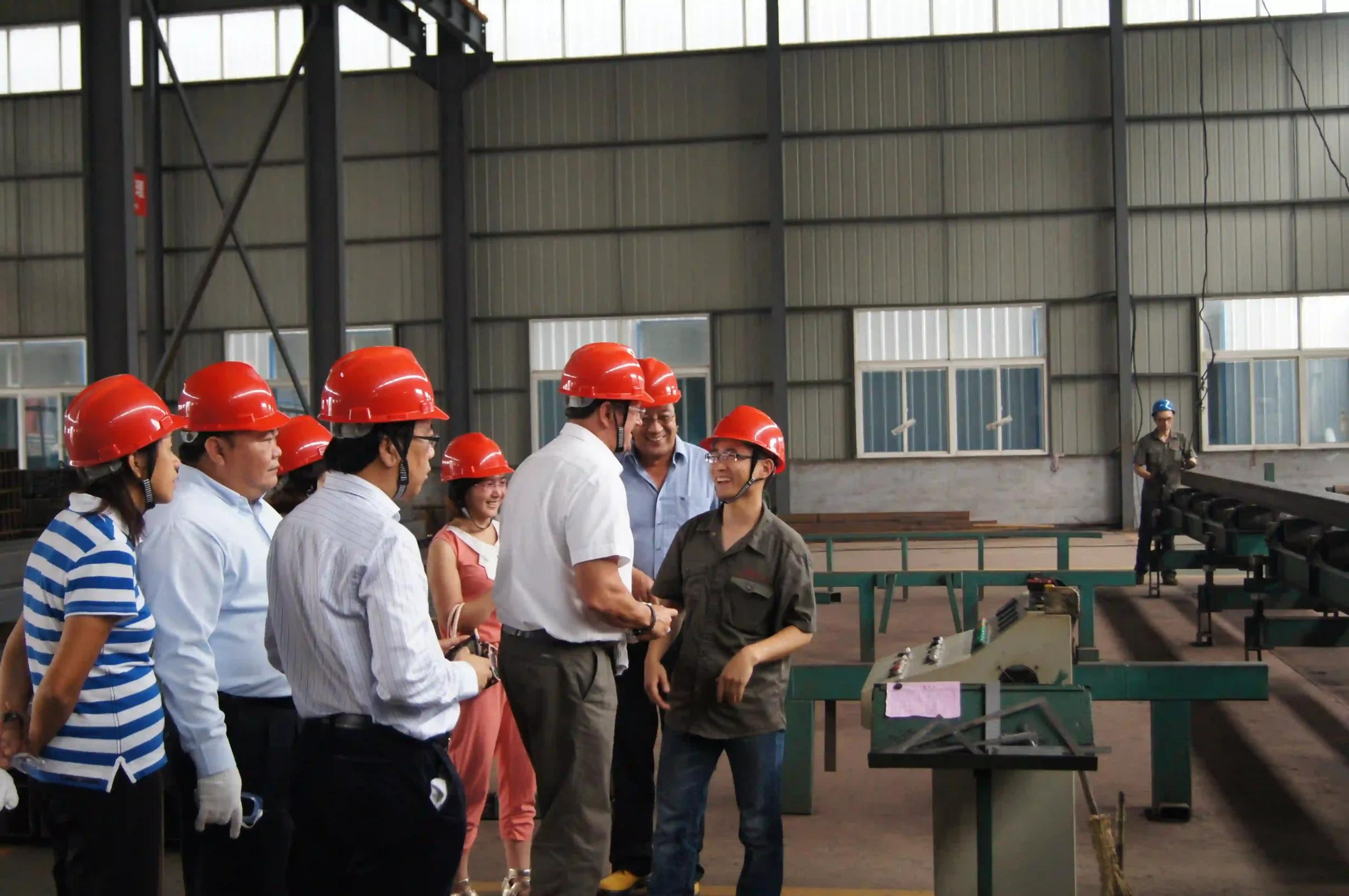 Overseas client representatives touring the SD XJY Steel tube production workshop.