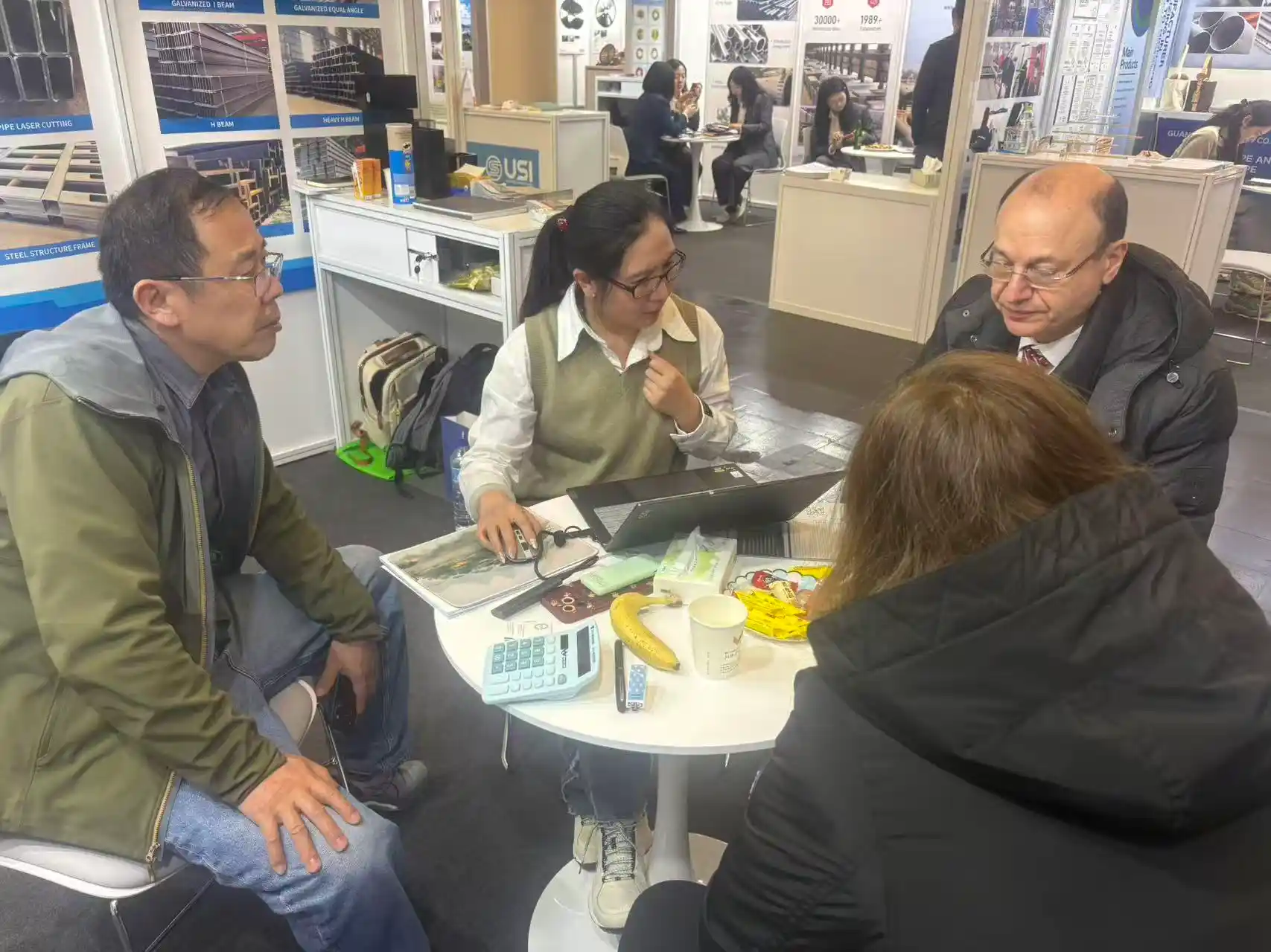 The SD XJY Steel international business team at a metal industry trade show.